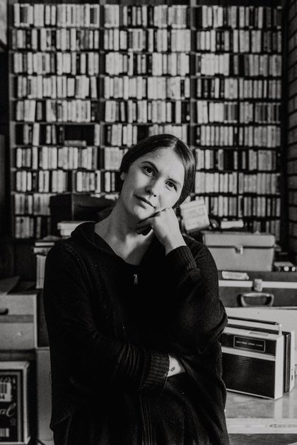 black and white photo of conservative woman in library