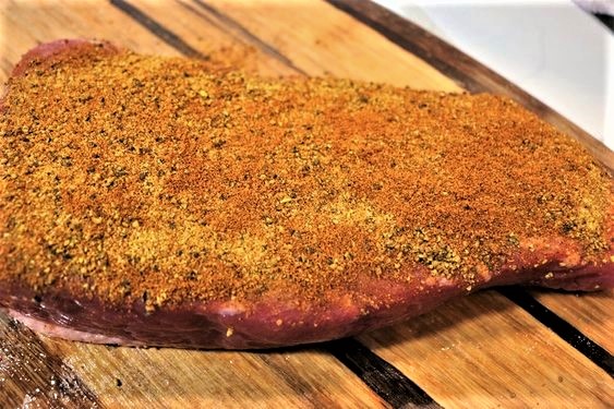 raw corned beef covered in spices
